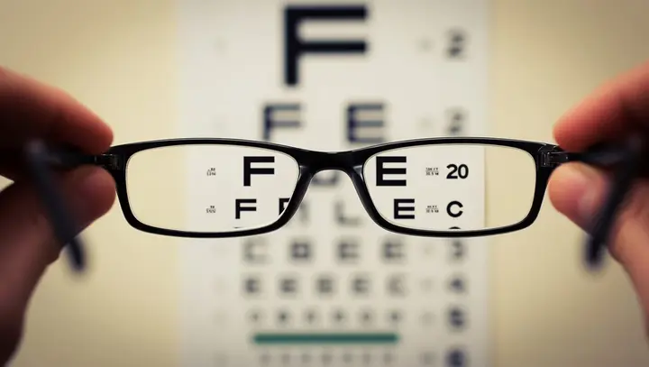 Dentist and patient — Davis Legacy Life dental and vision coverage